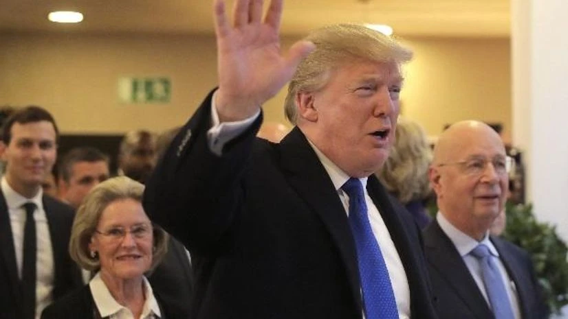 Donald Trump US President Donald Trump waves to journalists as he arrives during the annual meeting of the World Economic Forum in Davos, Switzerland. (Photo: AP/PTI)