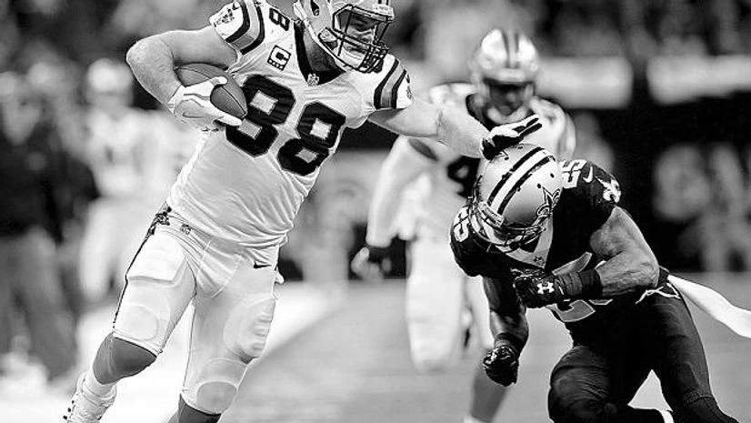 Carolina Panthers Carolina Panthers’s Greg Olsen (left) against New Orleans Saints defensive back Rafael Bush during the NFC Wild Card playoff football game. Reuters