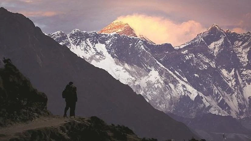 Light illuminates Mount Everest during sunset in Solukhumbu district, also known as the Everest region, in a file photo | File Photo: Reuters Light illuminates Mount Everest during sunset in Solukhumbu district, also known as the Everest region, in a file photo | File Photo: Reuters
