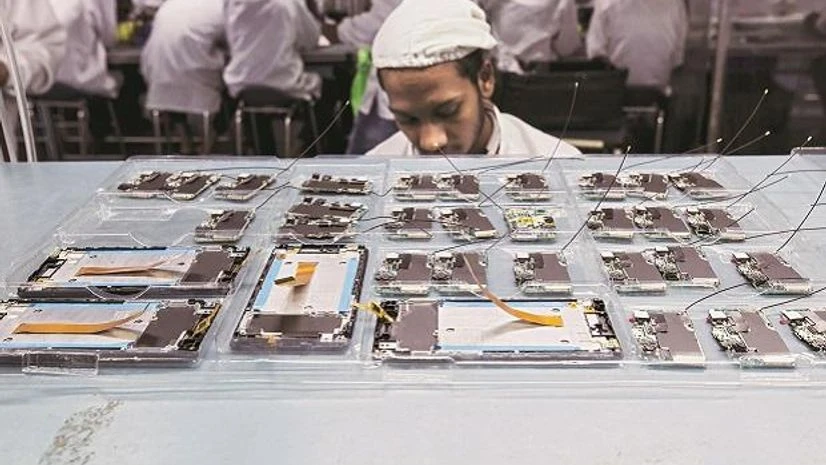 Factory, labour Smartphone components on a factory production line in Uttar Pradesh. Import duties on mobile phones are up from 15% to 20%