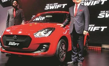 Auto Expo 2018: Maruti launches new, more spacious Swift at Rs 499,000 Maruti Suzuki Managing Director and CEO Kenichi Ayukawa (right) and senior executive director RS Kalsi showcase the all-new Swift