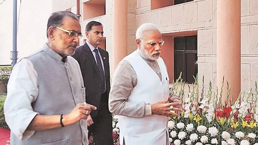 Prime Minister Narendra Modi arrives at a national conference on 'Doubling of Farmers Income by 2022' in New Delhi on Tuesday, accompanied by Union Minister for Agriculture and Farmers Welfare Radha Mohan Singh. Photo: PTI/PIB Prime Minister Narendra Modi arrives at a national conference on 'Doubling of Farmers Income by 2022' in New Delhi on Tuesday, accompanied by Union Minister for Agriculture and Farmers Welfare Radha Mohan Singh. Photo: PTI/PIB