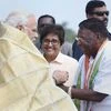 Prime Minister, Narendra Modi  being received by the Lieutenant Governor of Puducherry, Kiran Bedi and the Chief Minister of Puducherry V. Narayanasamy, on his arrival, in Puducherry. Photo: PTI
