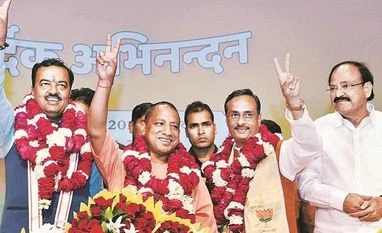Govt to pass ordinance to check arbitrary fee hike by schools: UP Dy CM CM Yogi Adityanath with his deputies K P Maurya, left, and Dinesh Sharma, right. They have to ensure the BJP's popularity till 2019