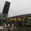 Kathmandu: Nepalese rescuers work after a passenger plane from Bangladesh crashed at the airport in Kathmandu, Nepal