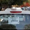 A note is pasted on a rear window of a car during a protest by Uber and Ola drivers, in New Delhi. Photo: Reuters