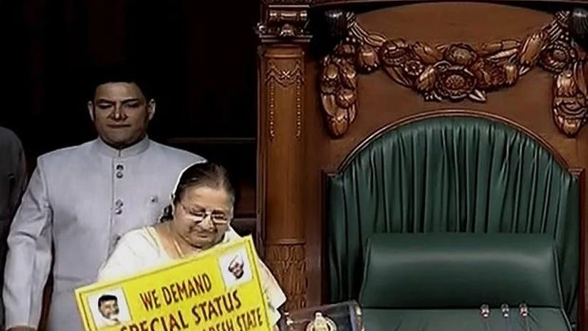 Opposition members protest Opposition members protest in front of Lok Sabha Speaker Sumitra Mahajan demanding special status for the state of Andhra Pradesh during the second phase of the budget session of Parliament, in New Delhi. (Photo: PTI/TV Grab)