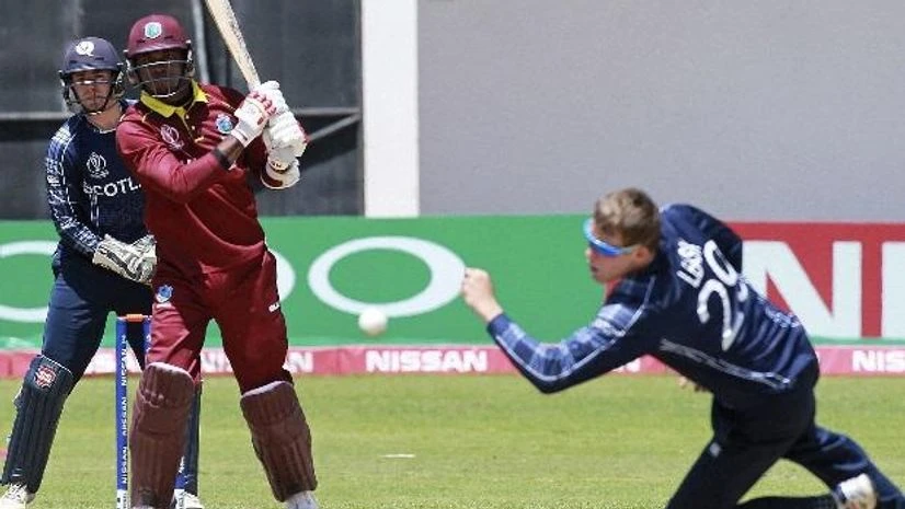 Marlon Samuels West Indies batsman Marlon Samuels, right, plays a shot as Scotland bowler Michael Leask, right, attempts a catch during their cricket world cup qualifier match at Harare Sports Club. (Photo: AP/PTI)