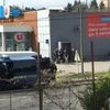 Police are seen at the scene of a hostage situation in a supermarket in Trebes, Aude, France