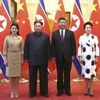 Chinese President Xi Jinping, second from right, and his wife Peng Liyuan, right, and North Korean leader Kim Jong Un, second from left, and his wife Ri Sol Ju. (Photo: AP/PTI)