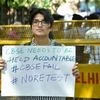 A 10th class Central Board of Secondary Education (CBSE) student displays a placard during a protest over the alleged paper leak, at Jantar Mantar in New Delhi