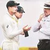 Cameron Bancroft and Australian captain Steven Smith with the umpires soon after Bancroft  was captured on camera tampering with the ball