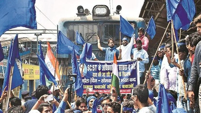 Patna: Bhim Army Sena members stop a train during the bandh call given by Dalit organisations Patna: Bhim Army Sena members stop a train during the bandh call given by Dalit organisations