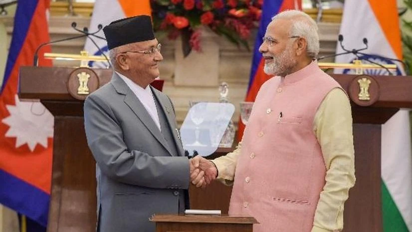 PM Modi and Oli Prime Minister Narendra Modi shakes hands with his Nepalese counterpart Khadga Prasad Oli during the inauguration of India-Nepal petroleum products pipeline and the Integrated Check Post (ICP), at Hyderabad House, in New Delhi. (Photo: PTI)