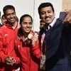 Sports Minister Rajyavardhan Singh Rathore takes selfie with the women's singles badminton gold medalist Saina Nehwal during the Commonwealth Games 2018, in Gold Coast, Australia on Sunday