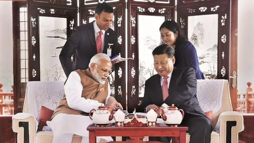 PM Modi, Xi Jinping Prime Minister Narendra Modi with Chinese President Xi Jinping inside a house boat in Wuhan, China. (Photo: PTI)