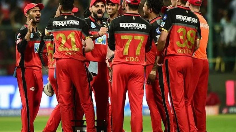 Royal Challengers Bangalore's Virat Kohli celebrates with teammates the wicket of Mumbai Indians' Rohit Sharma during the IPL 2018 cricket match at Chinnaswamy Stadium in Bengaluru. Photo: PTI Royal Challengers Bangalore's Virat Kohli celebrates with teammates the wicket of Mumbai Indians' Rohit Sharma during the IPL 2018 cricket match at Chinnaswamy Stadium in Bengaluru. Photo: PTI