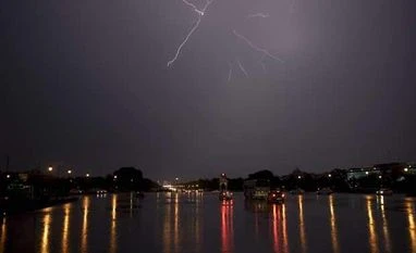 Monsoon to bring relief from heat in central, north India in 2-3 days: IMD File photo: Lightning seen during a thunderstorm over Rajpath in New Delhi. Photo: PTI