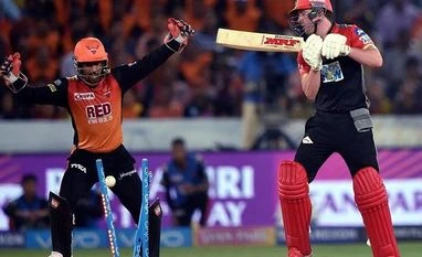 Sunrisers defend 146, win by 5 runs; RCB potentially out of IPL 2018 Royal Challengers Bangalore's AB de Villiers clean bowled by Sunrisers Hyderabad's Rashid Khan during the IPL 2018 T20 cricket match in Hyderabad. Photo: PTI