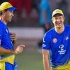 Chennai Super Kings player Shane Watson (R) shares a light moment with coach Stephen Fleming during a practice session. File photo: PTI