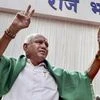 Karnataka Chief Minister B S Yeddyurappa flashes the victory sign after his swearing-in ceremony, at Raj Bhavan in Bengaluru