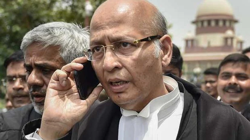 Senior Congress leader and Advocate Abhishek Singhvi leaves after a hearing in Karnataka government formation case, at Supreme Court in New Delhi Senior Congress leader and Advocate Abhishek Singhvi leaves after a hearing in Karnataka government formation case, at Supreme Court in New Delhi