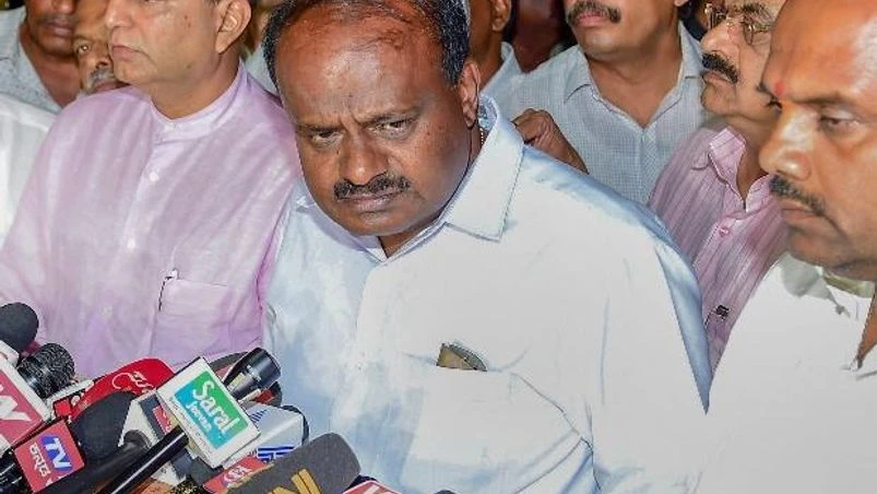 JD(S) leader H D Kumaraswamy speaks to media after meeting with Governor Vajubhai Vala in Bengaluru on Saturday. BJP leader B S Yediyurappa submited his resignation before the floor test JD(S) leader H D Kumaraswamy