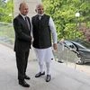 Russian President Vladimir Putin, left, and Indian Prime Minister Narendra Modi pose for a photo during their meeting in the Bocharov Ruchei residence in the Black Sea resort of Sochi, Russia, Monday, May 21, 2018.