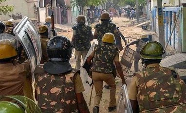 CB-CID sleuths in Tuticorin to probe violence, police firing Police personnel tackles as protestors demanding the closure of Vedanta's Sterlite Copper unit, gather in a street in Tuticorin | Photo: PTI