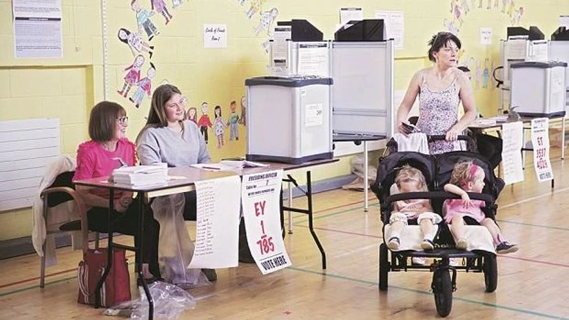 Ireland Abortion Law A woman arrives to vote with her children in Dublin on Friday as Ireland holds a referendum on liberalising its law on abortion Photo: Reuters