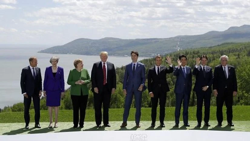 G-7 summit Donald Tusk, Theresa May, Angela Merkel, Donald Trump, Justin Trudeau, Emmanuel Macron, Shinzo Abe, Giuseppe Conte and Jean-Claude Juncker gather for the family photo at the G-7 summit. (Photo: AP/PTI)