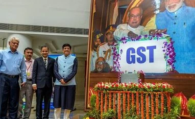 gst, one year of gst, goods and services tax Finance Minister Piyush Goyal poses for a photo during the 'GST Day celebration' on completing one year, at Ambedkar International Centre in New Delhi on Sunday