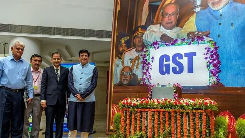 gst, one year of gst, goods and services tax Finance Minister Piyush Goyal poses for a photo during the 'GST Day celebration' on completing one year, at Ambedkar International Centre in New Delhi on Sunday