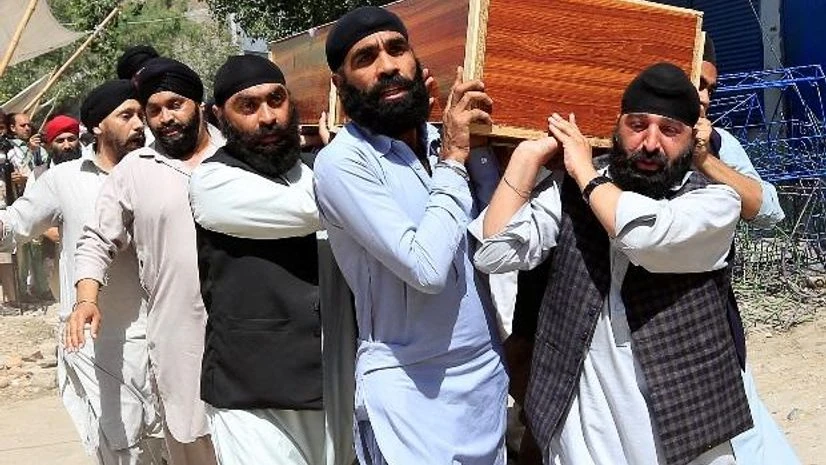 Afghan Sikh men carry the coffin of one of the victims of the blast in Jalalabad city, Afghanistan. Photo: Reuters Afghanistan blast