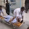 People rush an injured person to a hospital in Quetta, Pakistan. Photo: PTI