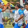 Indian archers Rajat Chauhan, Aman Saini and Abhishek Verma celebrate after scoring points in men's compound team event, at the Asian Games 2018. Photo: PTI