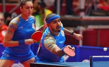 CWG: Twin delight for Sharath Kamal, enters mixed and men's doubles semis India's Achanta Sharath Kamal and Manika Batra in action during their quarter-final match against DPR Korea in Tablte Tennis Mixed Doubles. (Photo: PTI)