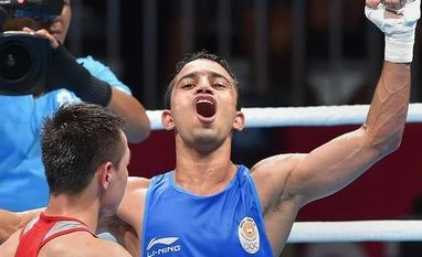 Asian Games 2018: Amit beats Rio champ to win India its only boxing gold Jakarta: India's Amit Panghal (in blue) gestures after defeating Uzbekistan's Hasanboy Dusmatov during the Men's light fly (46-49kg) boxing final bout at the 18th Asian Games 2018 in Jakarta, Indonesia on Saturday, Sept 1, 2018. Photo: PTI