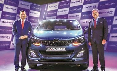 Mahindra & Mahindra Marazzo to get costlier by up to Rs 40,000 from Jan 1 M&M Executive Chairperson Anand Mahindra with Managing Director Pawan Goenka at the launch of Mahindra Marazzo multi-purpose vehicle, in Nashik on Monday. The car's prices starts from Rs 999,000 | Photo: PTI