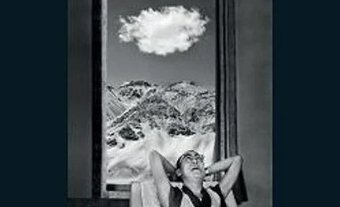 'A God in Exile' review: Raghu Rai captures the many moods of Dalai Lama a god in exile