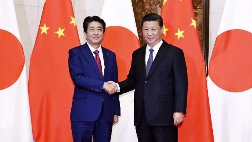 Japanese Prime Minister Shinzo Abe, left, poses with Chinese President Xi Jinping Japanese Prime Minister Shinzo Abe, left, poses with Chinese President Xi Jinping