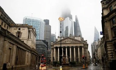 Bank of England hints at faster rate hikes, but post-Brexit options open The Bank of England is seen in the financial district during rainy weather in London, Britain