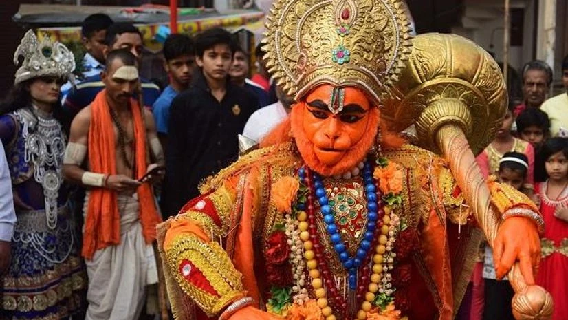 An artist dressed as Lord Hanuman dances during a religious procession on the occasion of 'Hanuman Jayanti' An artist dressed as Lord Hanuman dances during a religious procession on the occasion of 'Hanuman Jayanti'