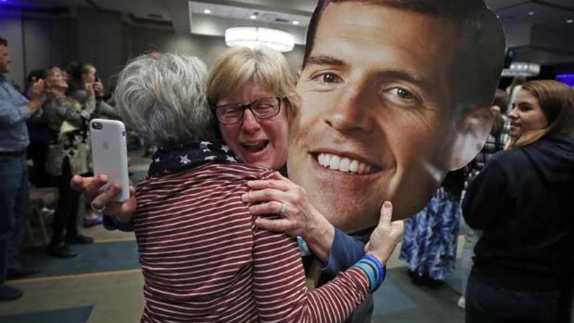 us midterm elections us elections, republicans, Conor Lamb Supporters of Rep. Conor Lamb, D-Pa, Joanie Foran, left, and Linda Bishop, of Progress, Pa., begin to celebrate after hearing CNN projected Lamb the winner in Pennsylvania's 17th Congressional District