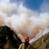 Firefighters battle the Woolsey Fire as it continues to burn in Malibu, California