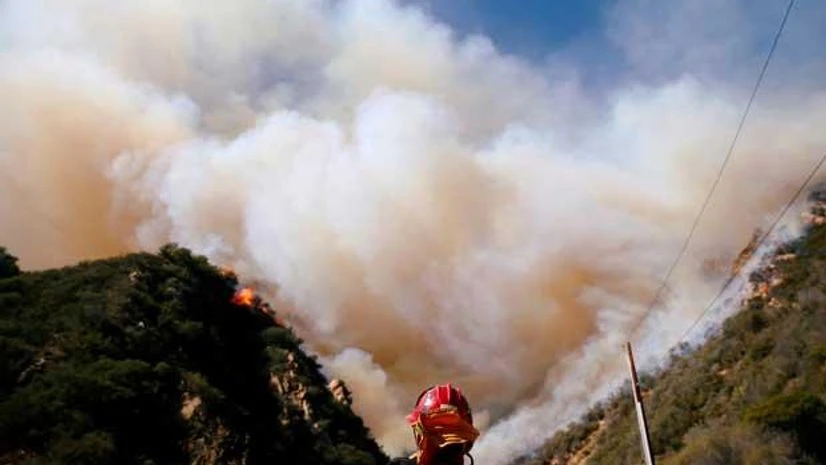 California wildfire Firefighters battle the Woolsey Fire as it continues to burn in Malibu, California