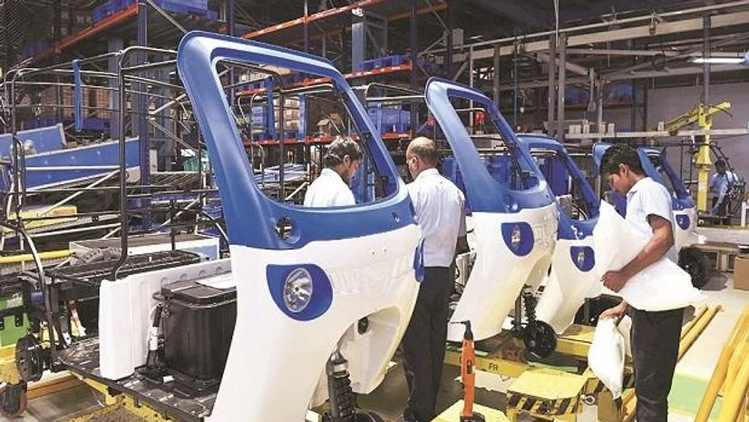 Engineers at the M&M’s EV unit in Bengaluru on Thursday photo: pti Engineers at the M&M’s EV unit in Bengaluru on Thursday photo: pti