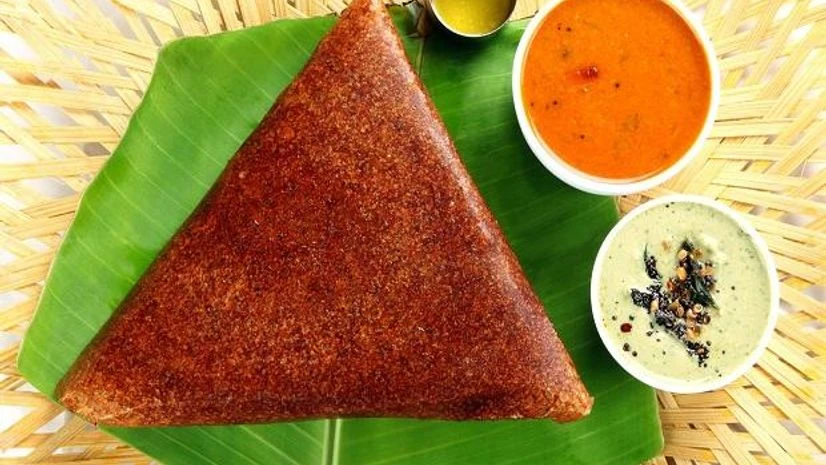 The Karnataka variant of a dosa is usually fluffier with a thick layer of podi The Karnataka variant of a dosa is usually fluffier with a thick layer of podi