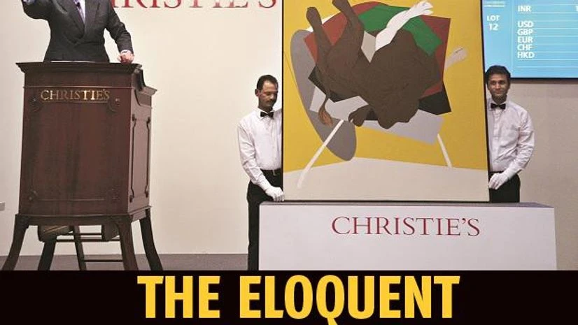 William Robinson conducts an auction for Christie’s William Robinson conducts an auction for Christie’s