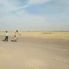 Workers move across arid landscape at site of Pachpadra refinery project | Photo: Sai Manish